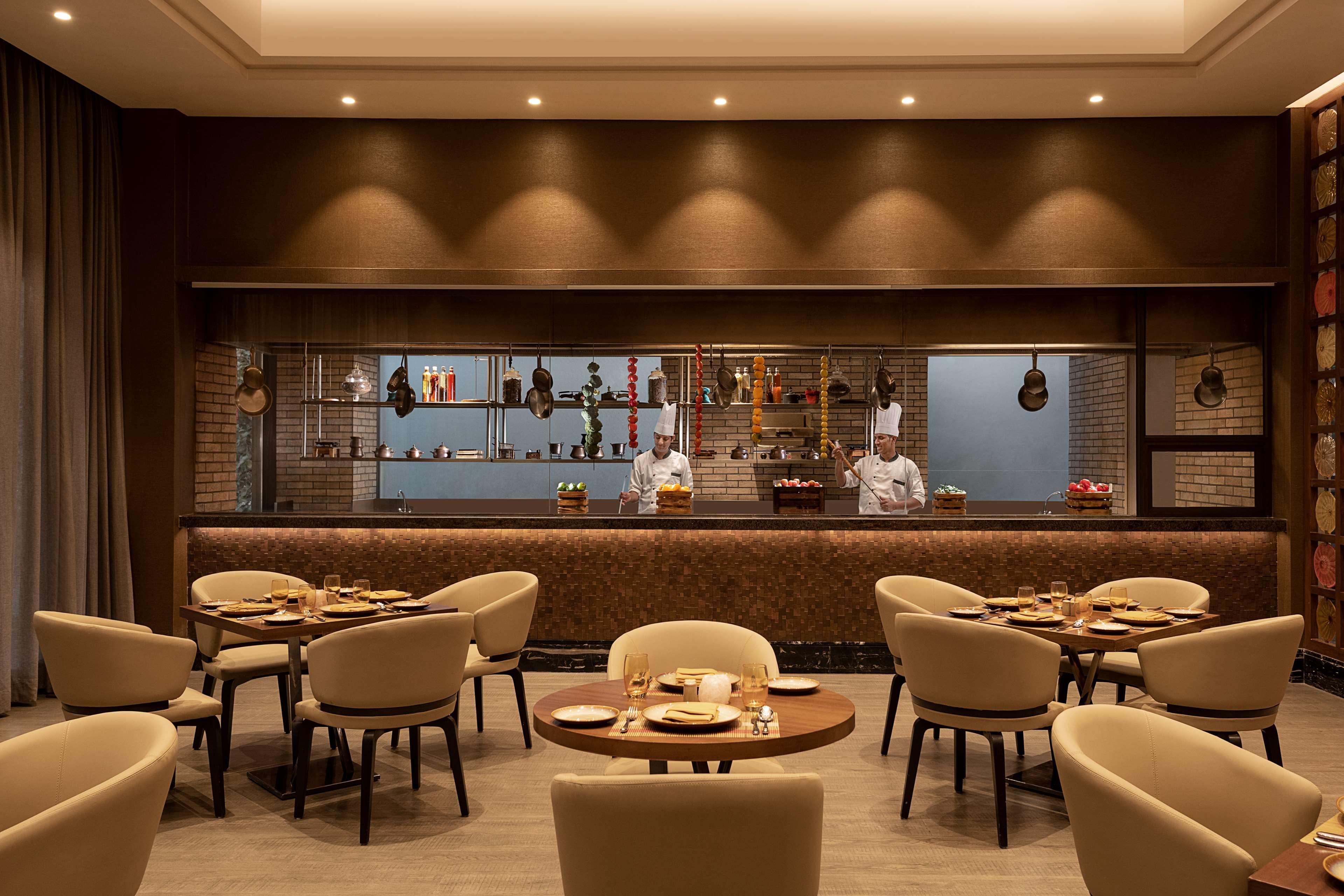 Radisson Mumbai Andheri Midc Экстерьер фото The restaurant's interior